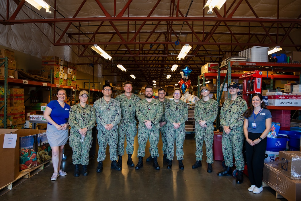 Sailors assigned to the Independence-variant littoral combat ship USS Montgomery (LCS 8) pose for a photo after assisting in organizing food and supplies to be distributed to the community as a part of the annual Rose Festival during Portland Fleet Week in Portland, Oregon, June 7, 2024. Portland Fleet Week is a time-honored celebration of the sea services and provides an opportunity for the citizens of Oregon to meet Sailors, Marines and Coast Guardsmen, as well as witness firsthand the latest capabilities of today’s maritime services. (U.S. Navy photo by Mass Communication Specialist 2nd Class Jordan Jennings)