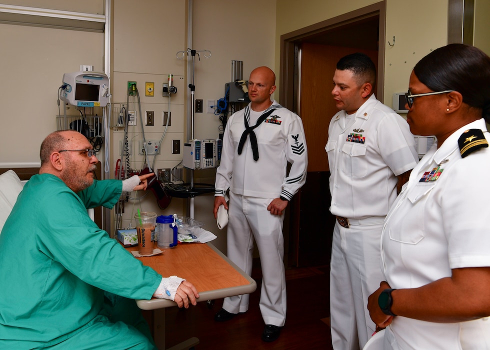 Sailors assigned to the Independence-variant littoral combat ship USS Montgomery (LCS 8) speak to Army veteran Thomas Papke during a visit to Portland VA Medical Center as part of the annual Portland Fleet Week and Rose Festival in Portland, Oregon June 7, 2024. Portland Fleet Week is a time-honored celebration of the sea services and provides an opportunity for the citizens of Oregon to meet Sailors, Marines and Coast Guardsmen, as well as witness firsthand the latest capabilities of today’s maritime services. (U.S. Navy photo by Mass Communication Specialist 1st Class Heather C. Wamsley)