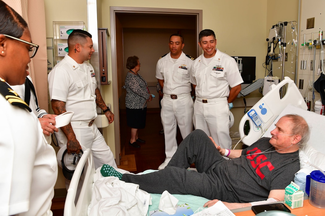 Sailors assigned to the Independence-variant littoral combat ship USS Montgomery (LCS 8) speak to Navy veteran Salvador Gonzales Jr. during a visit to Portland VA Medical Center as part of the annual Portland Fleet Week and Rose Festival in Portland, Oregon June 7, 2024. Portland Fleet Week is a time-honored celebration of the sea services and provides an opportunity for the citizens of Oregon to meet Sailors, Marines and Coast Guardsmen, as well as witness firsthand the latest capabilities of today’s maritime services. (U.S. Navy photo by Mass Communication Specialist 1st Class Heather C. Wamsley)