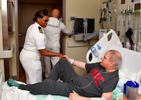 Lt. j.g. Erica Jackson, a surface warfare officer assigned to the Independence-variant littoral combat ship USS Montgomery (LCS 8), shakes hands with Navy veteran Salvador Gonzalez during a visit to Portland VA Medical Center as part of the annual Portland Fleet Week and Rose Festival in Portland, Oregon June 7, 2024. Portland Fleet Week is a time-honored celebration of the sea services and provides an opportunity for the citizens of Oregon to meet Sailors, Marines and Coast Guardsmen, as well as witness firsthand the latest capabilities of today’s maritime services. (U.S. Navy photo by Mass Communication Specialist 1st Class Heather C. Wamsley)