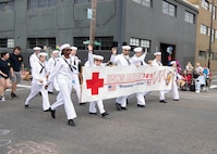 Sailors assigned to the hospital ship hospital ship USNS Mercy (T-AH 19) march in the Grand Floral Parade during the annual Portland Fleet Week and Rose Festival in Portland, Oregon June 8, 2024. Portland Fleet Week is a time-honored celebration of the sea services and provides an opportunity for the citizens of Oregon to meet Sailors, Marines and Coast Guardsmen, as well as witness firsthand the latest capabilities of today’s maritime services. (U.S. Navy photo by Mass Communication Specialist 1st Class Heather C. Wamsley)