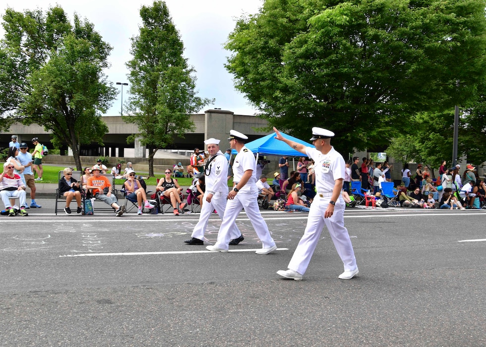 U.S. Navy Sailors march in the Grand Floral Parade during the annual Portland Fleet Week and Rose Festival in Portland, Oregon June 8, 2024. Portland Fleet Week is a time-honored celebration of the sea services and provides an opportunity for the citizens of Oregon to meet Sailors, Marines and Coast Guardsmen, as well as witness firsthand the latest capabilities of today’s maritime services. (U.S. Navy photo by Mass Communication Specialist 1st Class Heather C. Wamsley)
