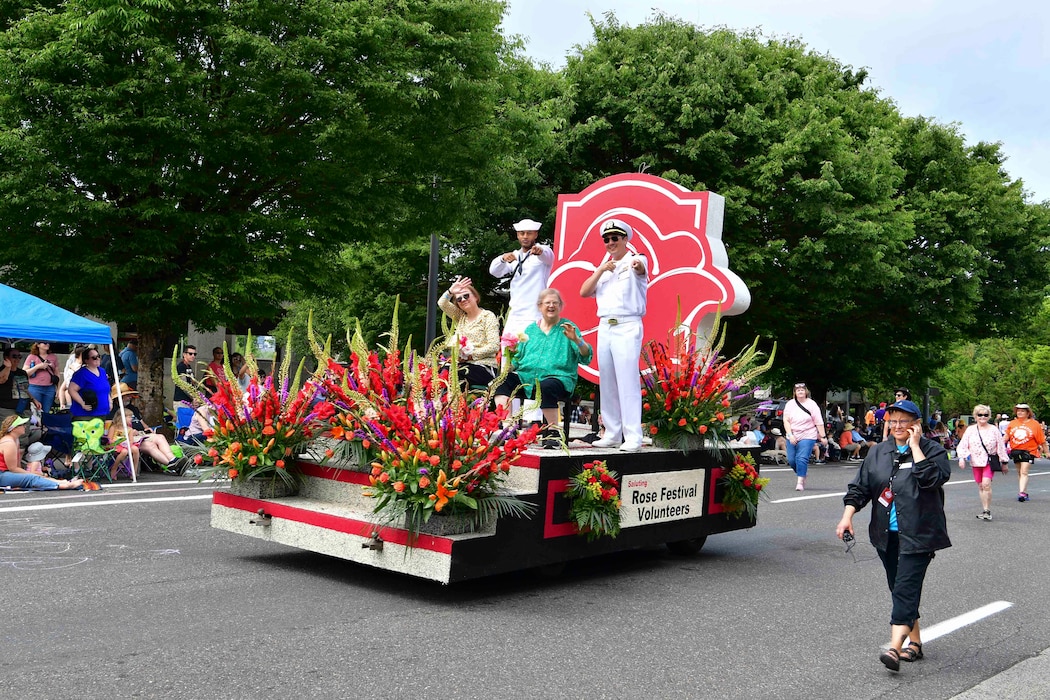 U.S. Navy Sailors ride on a float in the Grand Floral Parade during the annual Portland Fleet Week and Rose Festival in Portland, Oregon June 8, 2024. Portland Fleet Week is a time-honored celebration of the sea services and provides an opportunity for the citizens of Oregon to meet Sailors, Marines and Coast Guardsmen, as well as witness firsthand the latest capabilities of today’s maritime services. (U.S. Navy photo by Mass Communication Specialist 1st Class Heather C. Wamsley)