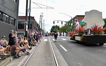 U.S. Navy Sailors participate in the Grand Floral Parade during the annual Portland Fleet Week and Rose Festival in Portland, Oregon June 8, 2024. Portland Fleet Week is a time-honored celebration of the sea services and provides an opportunity for the citizens of Oregon to meet Sailors, Marines and Coast Guardsmen, as well as witness firsthand the latest capabilities of today’s maritime services. (U.S. Navy photo by Mass Communication Specialist 1st Class Heather C. Wamsley)