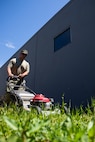 Gas Turbine Systems Technician (Mechanical) 1st Class Austin Holbert assigned to the Independence-variant littoral combat ship USS Montgomery (LCS 8) assists in beautifying the exterior of a thrift store organized by Union Gospel Mission as a part of the annual Rose Festival during Portland Fleet Week in Portland, Oregon, June 8, 2024. Portland Fleet Week is a time-honored celebration of the sea services and provides an opportunity for the citizens of Oregon to meet Sailors, Marines and Coast Guardsmen, as well as witness firsthand the latest capabilities of today’s maritime services. (U.S. Navy photo by Mass Communication Specialist 2nd Class Jordan Jennings)