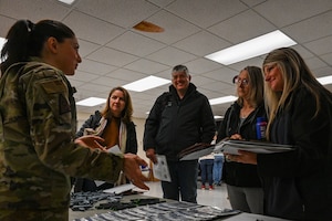Honorary commanders listen to a brief
