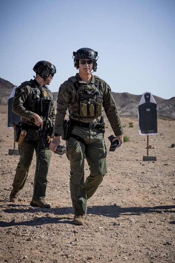U.S. Marine Corps Cpl. Chase Johnson, a Houston, Texas native, team leader with the Provost Marshal's Office Special Reaction Team, Marine Air-Ground Task Force Training Command, Marine Corps Air-Ground Combat Center, conducts a rifle qualification at rifle range 1A, MCAGCC, Twentynine Palms, California, June 5, 2024. SRT is a specialized team of military police officers trained to respond to high-risk and emergency calls in order to preserve life and contain incidents. The team conducted the rifle qualification as a part of their routine training. (U.S. Marine Corps photo by Lance Cpl. Iris Gantt)