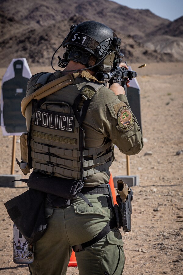 U.S. Marine Corps Cpl. Chase Johnson, a Houston, Texas native, team leader with the Provost Marshal's Office Special Reaction Team, Marine Air-Ground Task Force Training Command, Marine Corps Air-Ground Combat Center, shoots an M4 carbine at rifle range 1A, MCAGCC, Twentynine Palms, California, June 5, 2024. SRT is a specialized team of military police officers trained to respond to high-risk and emergency calls in order to preserve life and contain incidents. The team conducted the rifle qualifications as a part of their routine training. (U.S. Marine Corps photo by Lance Cpl. Iris Gantt)