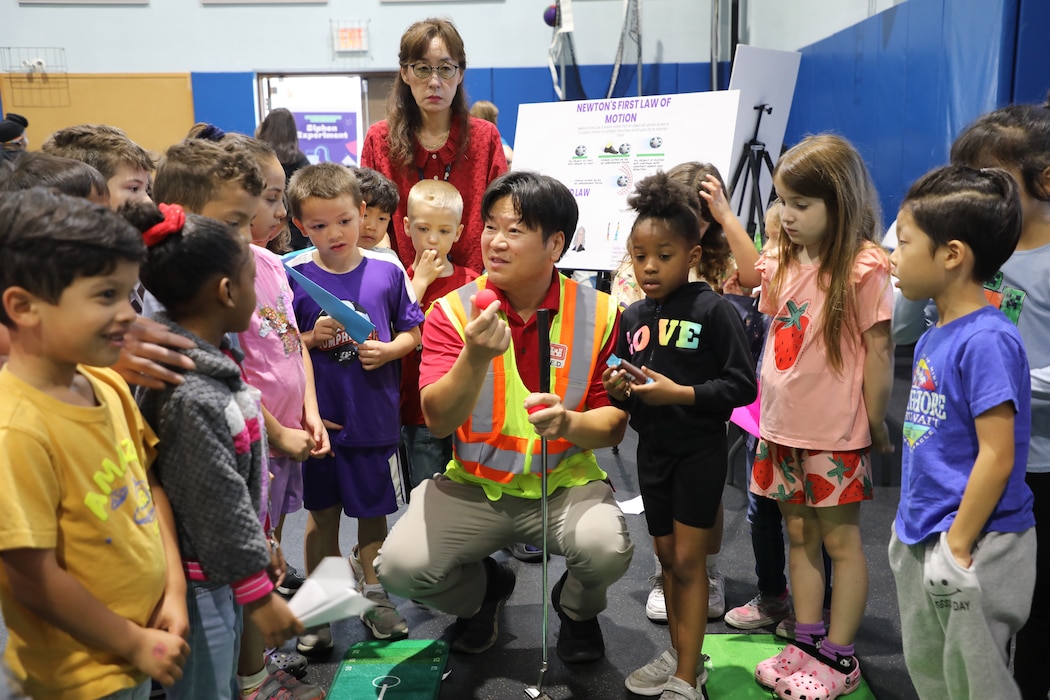 Mr. Christopher Brincefield, Programs Branch Chief, U.S. Army Corps of Engineers – Far East District, engages with students at a STEAM event hosted by USACE at Central Elementary School on Camp Humphreys, South Korea, on May 22. Highlighting the vital role of STEAM in our everyday lives, Mr. Brincefield inspires curiosity and a passion for learning through interactive and educational activities. (U.S. Army photo by Yohan An)