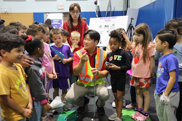 Mr. Christopher Brincefield, Programs Branch Chief, U.S. Army Corps of Engineers – Far East District, engages with students at a STEAM event hosted by USACE at Central Elementary School on Camp Humphreys, South Korea, on May 22. Highlighting the vital role of STEAM in our everyday lives, Mr. Brincefield inspires curiosity and a passion for learning through interactive and educational activities. (U.S. Army photo by Yohan An)