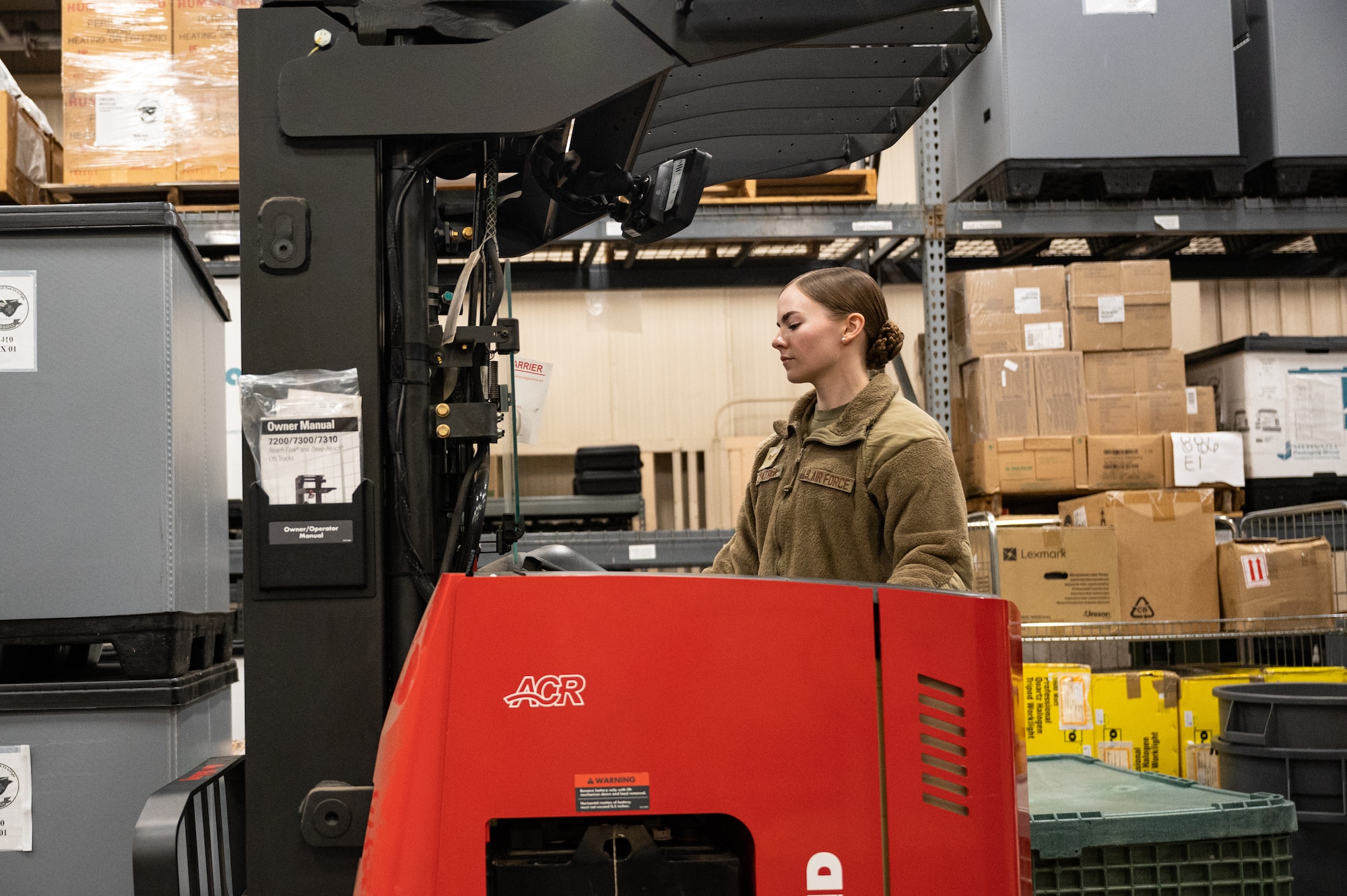 Senior Airman Laura Fitzpatrick, 8th Healthcare Operations Squadron medical material technician, operates a loader.