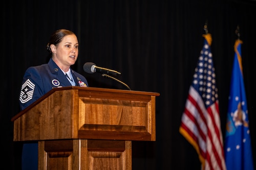 Chief Master Sgt. Fontaine gives a speech from behind a podium