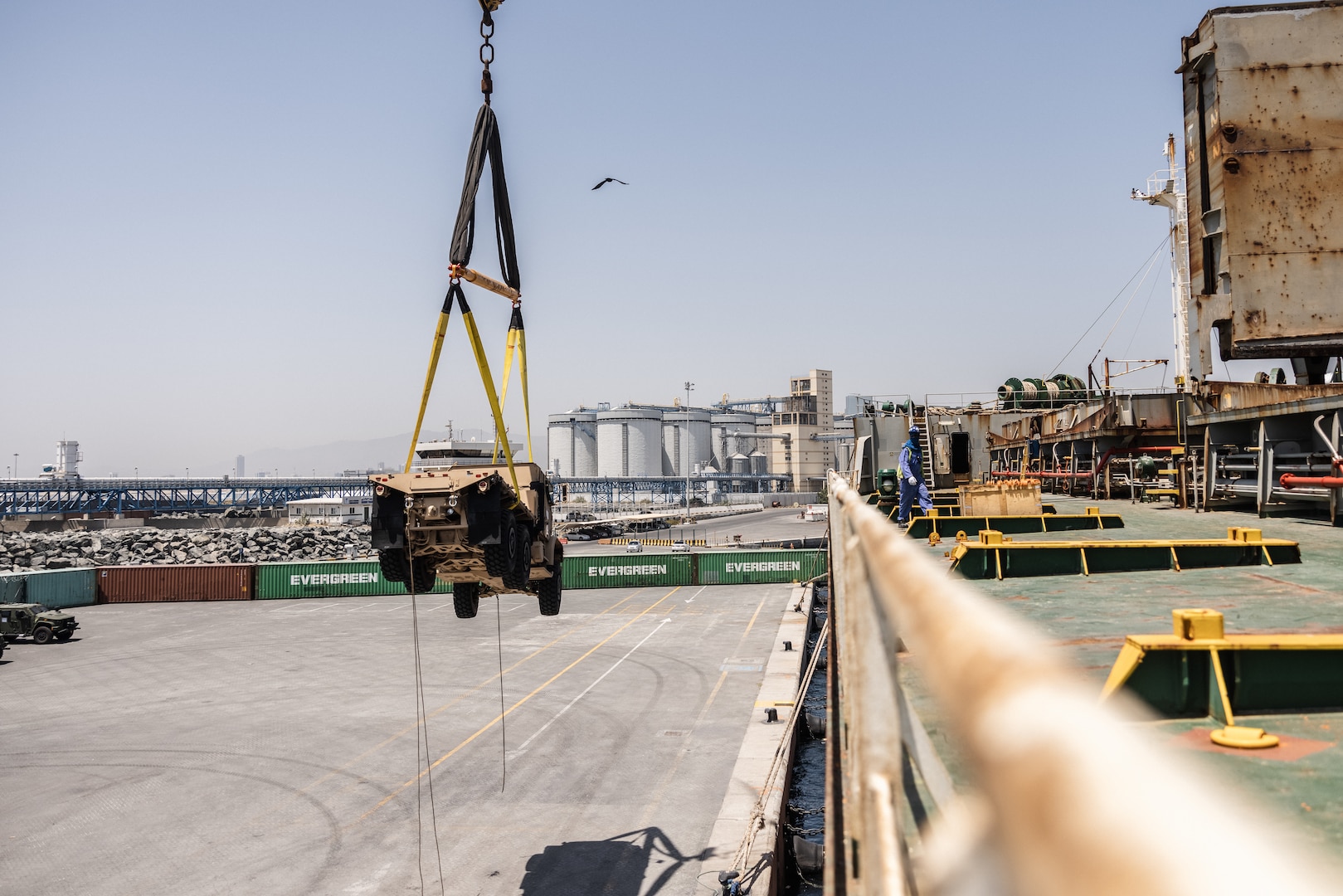 U.S. Marines with 2nd Distribution Support Battalion, Combat Logistics Regiment 2, 2nd Marine Logistics Group, load a Medium Tactical Vehicle Replacement MK26 wrecker after exercise Native Fury 24 at a port in the United Arab Emirates, May 28, 2024. Exercise Native Fury 24 is a key multi-lateral exercise sponsored by U.S. Central Command and executed by U.S. Marine Corps Forces Central Command in collaboration with the Kingdom of Saudi Arabia and the United Arab Emirates. This iteration emphasizes the strategic use of logistics and leverage the extensive network of roads and infrastructure across the Arabian Peninsula. (U.S. Marine Corps photo by Cpl. Meshaq Hylton)