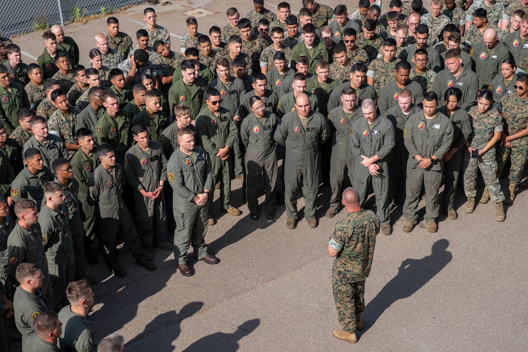U.S. Marine Corps Col. Sean Dynan, bottom center, commanding officer of the 15th Marine Expeditionary Unit, speaks to Marines and Sailors of Marine Medium Tiltrotor Squadron (VMM) 165 (Reinforced), 15th MEU, following an awards formation at Marine Corps Air Station Miramar, California, June 10, 2024. Capt. Steven Maire and Capt. Joseph Carey were presented Navy and Marine Corps

Commendation Medals for providing lifesaving aid to a man suffering a medical emergency May 23, 2024, at Dallas Fort Worth International Airport. (U.S. Marine Corps photo by Cpl. Amelia Kang)