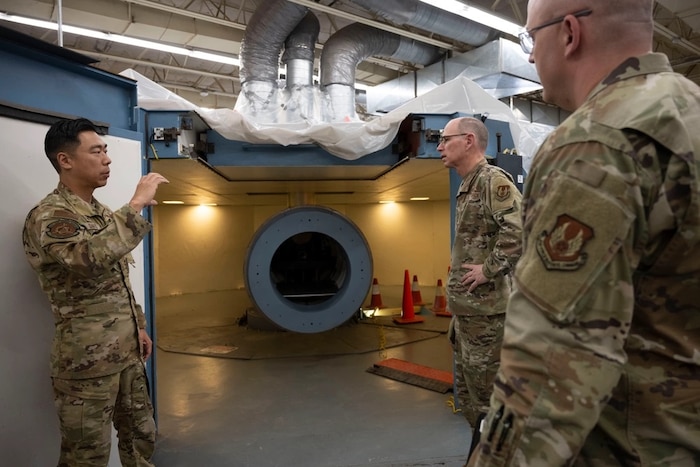 U.S. Air Force Lt. Col. Brian Davis, 746th Test Squadron commander, left, briefs U.S. Air Force Gen. Duke Z. Richardson, Air Force Materiel Command commander, center, and U.S. Air Force Chief Master Sgt. James “Bill” E. Fitch II, AFMC command chief, on the test squadron’s projects and challenges at Holloman Air Force Base, New Mexico, May 15, 2024. The AFMC command team toured the Arnold Engineering Development Complex 704th Test Group facilities to gain a better understanding of their capabilities. (U.S. Air Force photo by Senior Airman Corinna Sanabia)