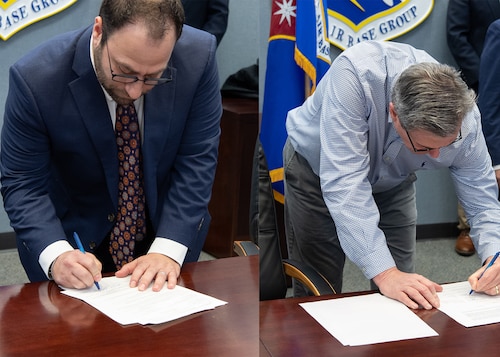 Illustration of men signing documents