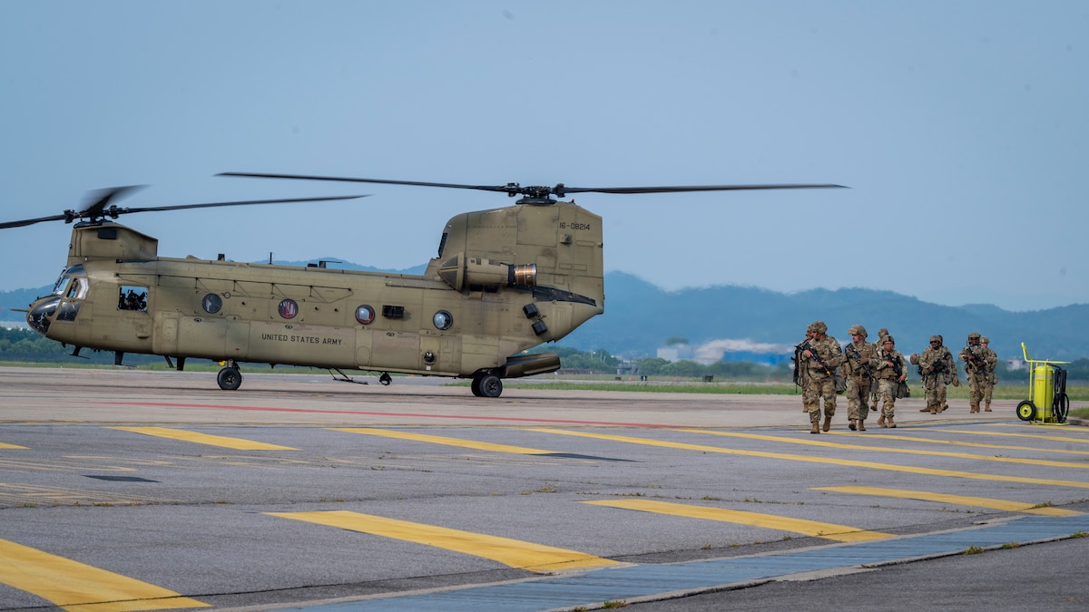 U.S. Soldiers assigned to the 3rd General Support Aviation Battalion, 2nd Combat Aviation Brigade, 2nd Infantry ROK/U.S. Combined Division, arrive for a joint training event at Osan Air Base, Republic of Korea, June 5, 2024. The U.S. Army CH-47 Chinook practiced landing in a man-made helicopter landing zone, which tested the Soldiers' capabilities to land in austere locations. (U.S. Air Force photo by Senior Airman Sabrina Fuller-Judd)