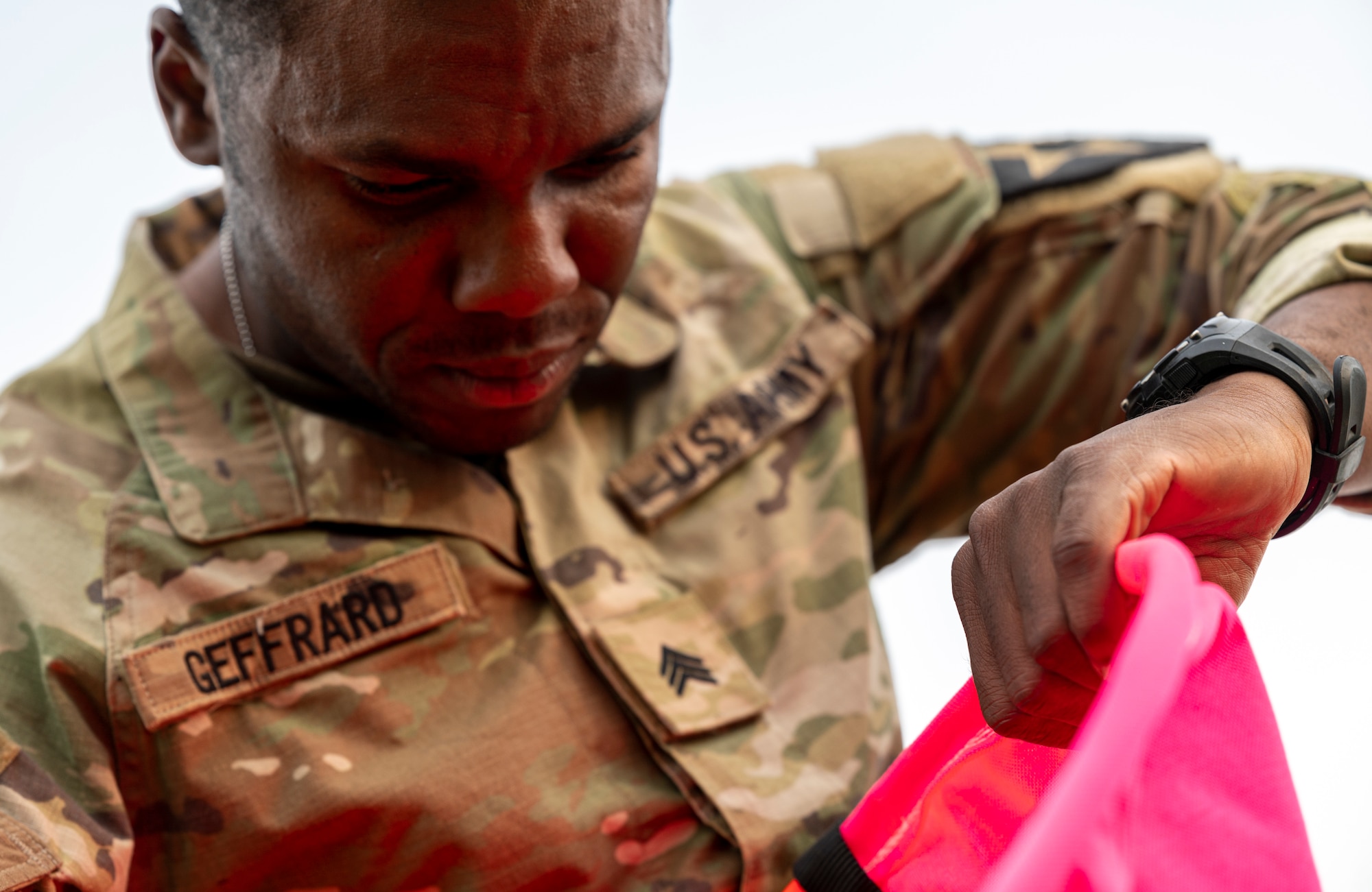 A U.S. Soldier assigned to the 3rd General Support Aviation Battalion, 2nd Combat Aviation Brigade, 2nd Infantry ROK/U.S. Combined Division, sets up a visual marker during a joint training event at Osan Air Base, Republic of Korea, June 5, 2024. Soldiers were taught how to assemble a helicopter landing zone for rotary wing aircraft by placing markers, which are used for pilots to identify the point of landing. (U.S. Air Force photo by Senior Airman Sabrina Fuller-Judd)