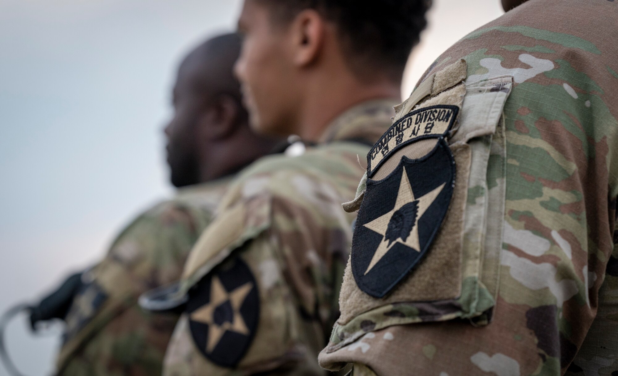 U.S. Soldiers assigned to the 3rd General Support Aviation Battalion, 2nd Combat Aviation Brigade, 2nd Infantry ROK/U.S. Combined Division, await the arrival of the CH-47 Chinook during a joint training event at Osan Air Base, Republic of Korea, June 5, 2024. This integrated training demonstrates the 51st Fighter Wing's ability to operate with other United States Forces Korea units in defense of the peninsula by improving and aligning skill sets across the command. (U.S. Air Force photo by Senior Airman Sabrina Fuller-Judd)