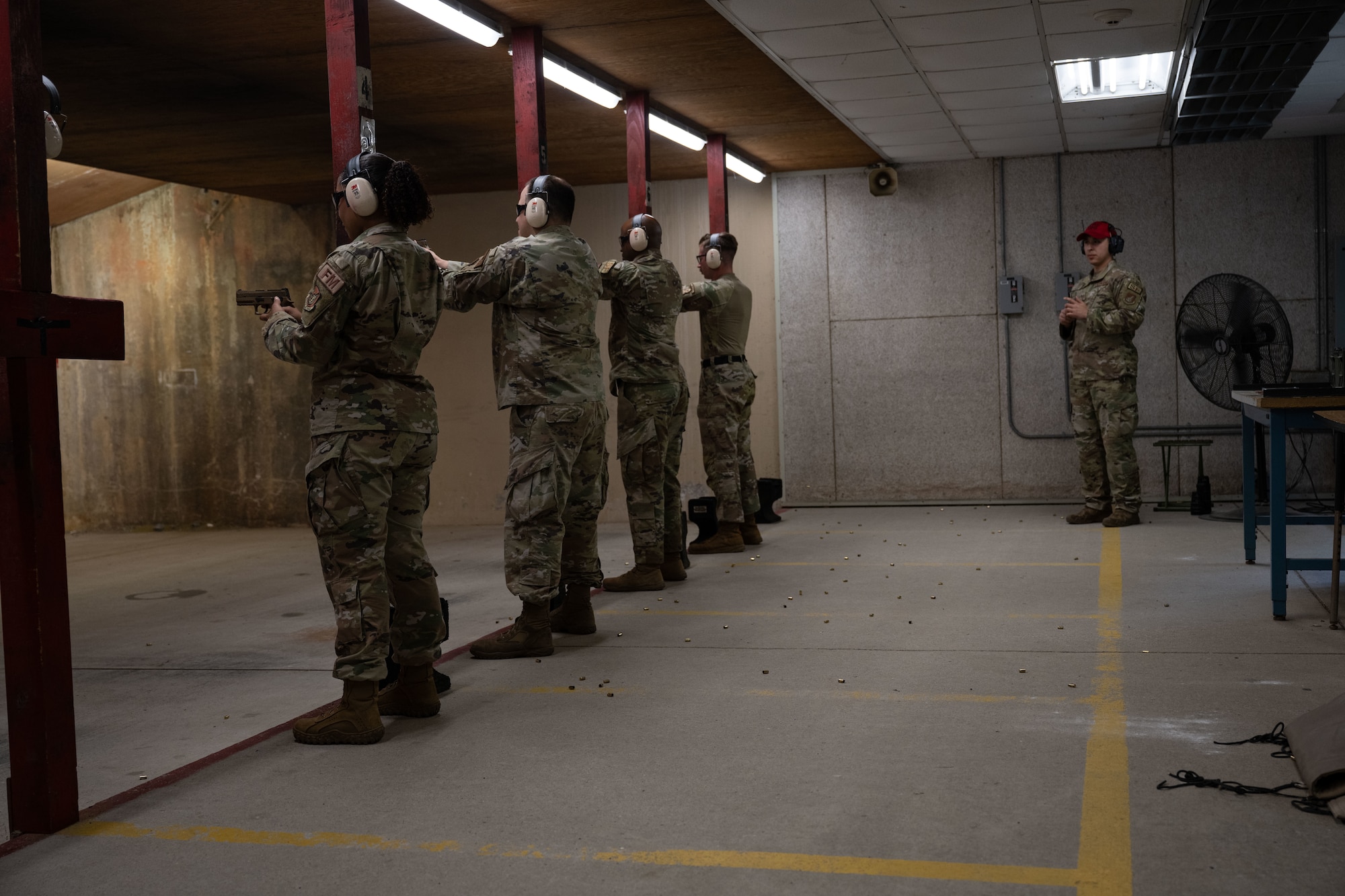 Shooters lineup to fire during the Excellence in Competition pistol match at Kunsan Air Base, Republic of Korea