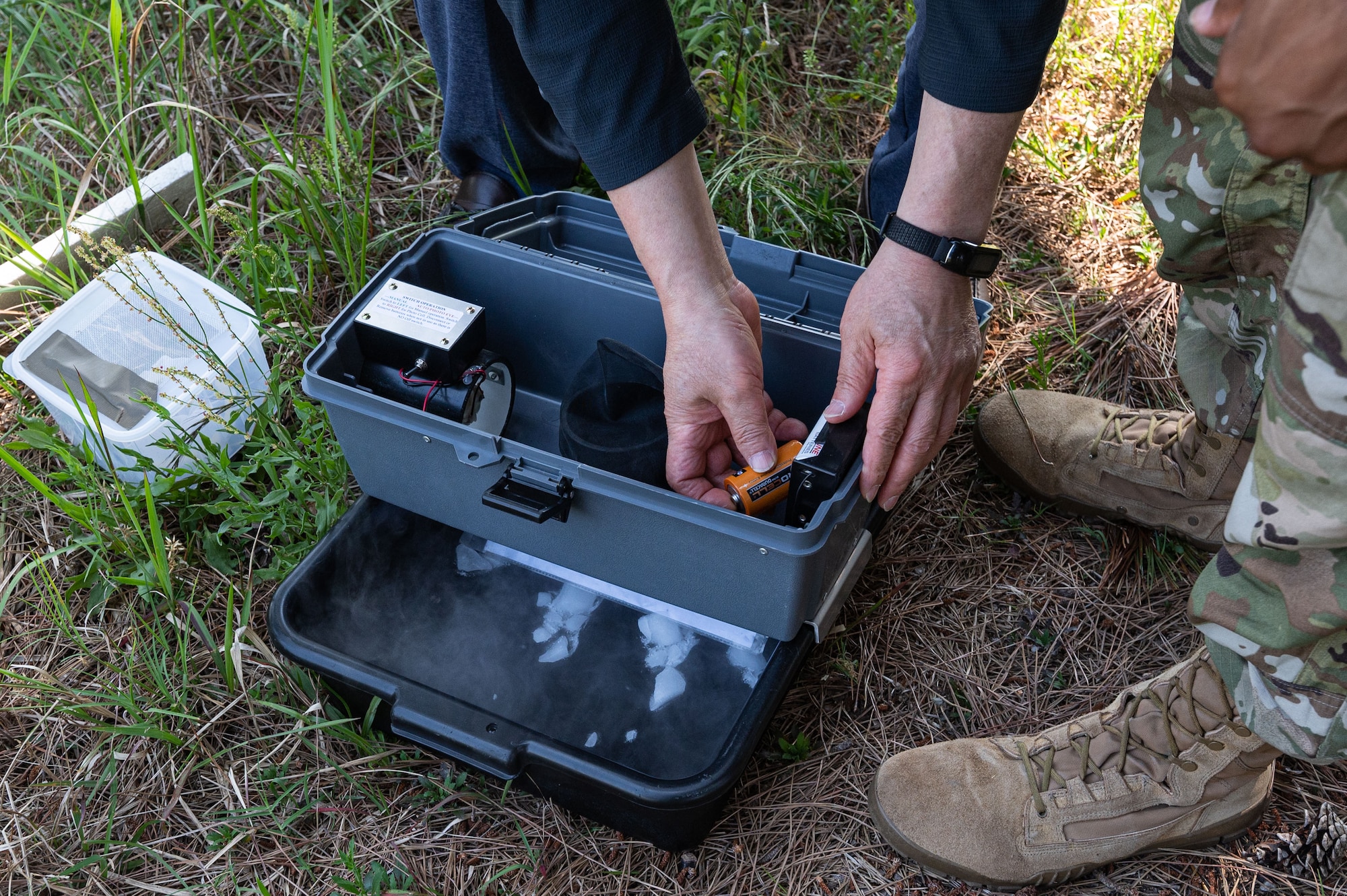 Kye Son Kim, 8th Operational Medical Readiness public health inspector, sets up a gravid trap during mosquito surveillance season.