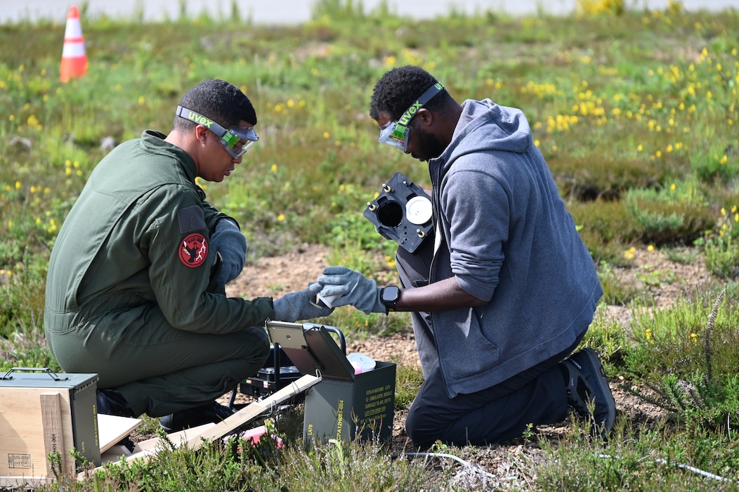 Matthew Dorn, 19th Electronic Warfare Center contractor, trains French Air Warfare Center Airmen on the Weapons Effect Simulation System during exercise Black Crow 24.