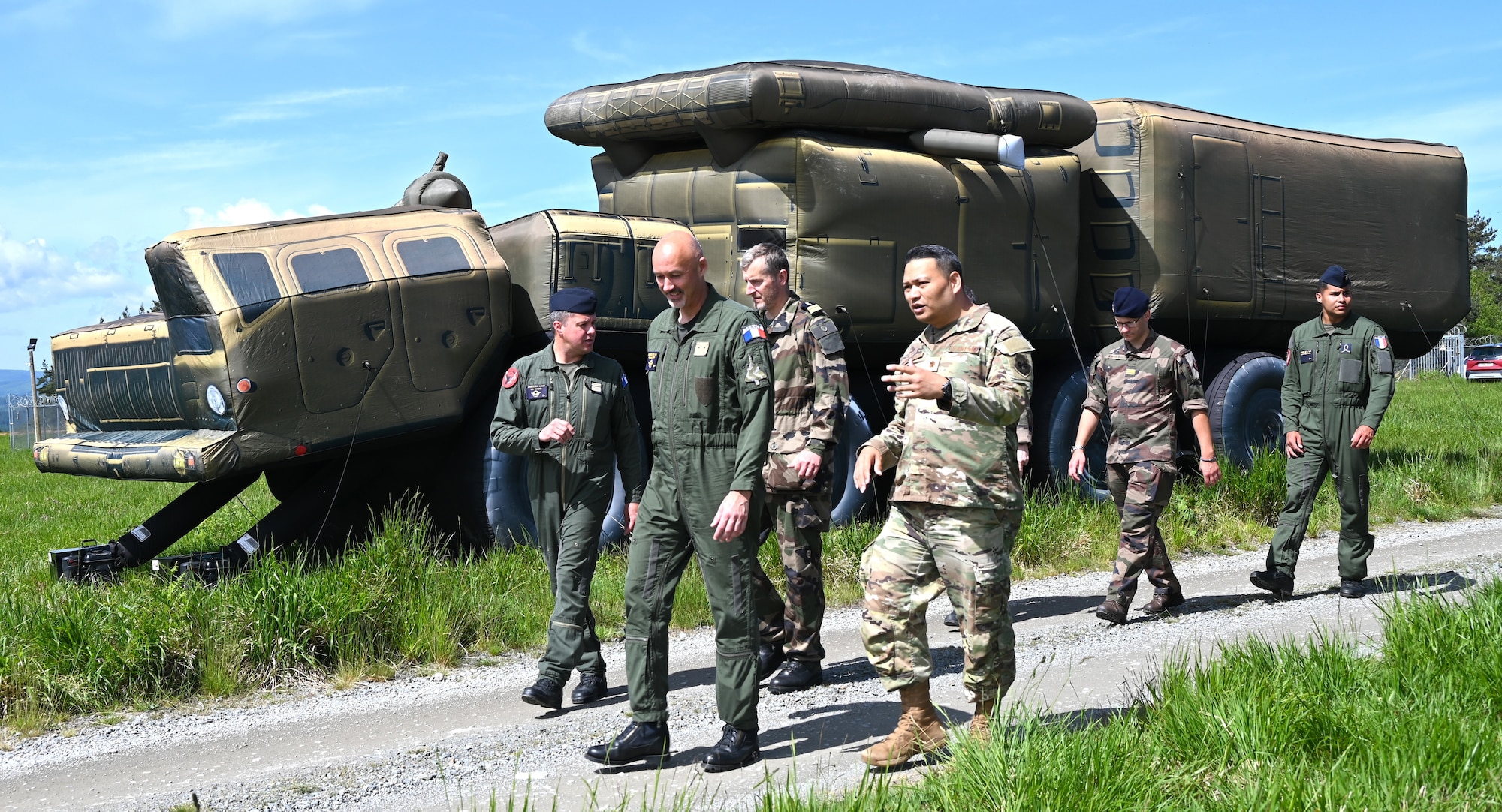U.S. Air Force Maj. Gordon Kai, 19th Electronic Warfare Squadron Director of Operations, provides exercise details to  Air Brigadier General Arnaud Gary, French Air Warfare Center commander.
