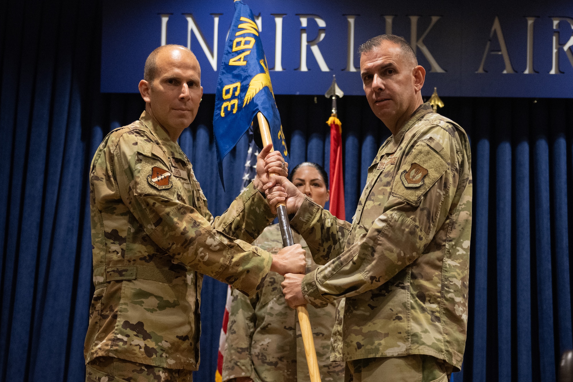 U.S. Air Force Col. Kevin Lord, 39th Air Base Wing commander, receives the unit guidon from Michael Gallucci, 39th Weapons System Security Group commander, during a change of command ceremony.
