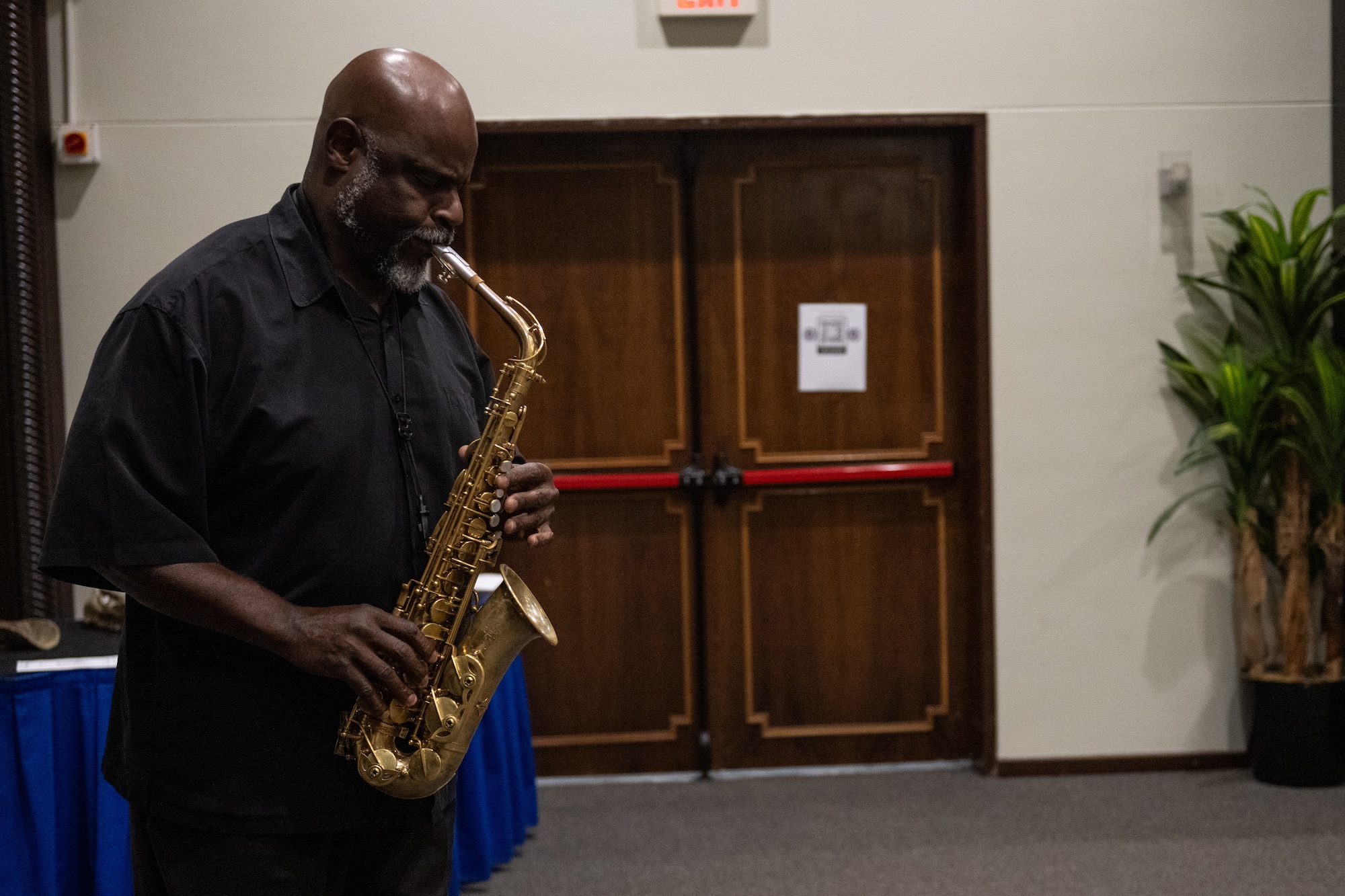 Buck Rodgers, 39th Force Support Squadron force development flight chief, plays a rendition of the national anthem with a saxophone at the 39th Weapons System Security Group change of command ceremony.