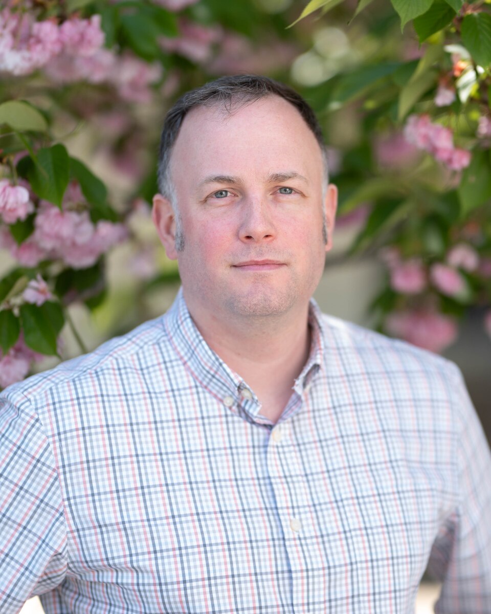 Matthew Zinkil, 436th Airlift Wing installation sexual assault victim advocate, poses for a portrait at Dover Air Force Base, Delaware, April 22, 2024. The welcoming of two new victim advocates offers readiness and care in advocating for Team Dover Airmen and their families for Sexual Assault, Prevention and Response. (U.S. Air Force photo by Airman Liberty Matthews)