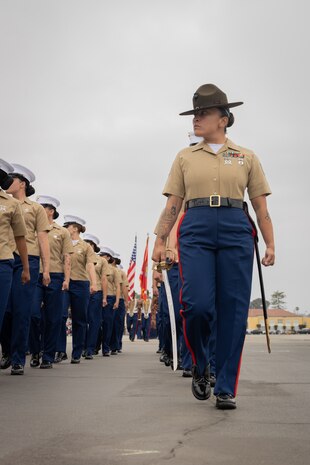 U.S. Marine Corps Staff Sgt. Norma G. Gavilanes, senior drill instructor with Fox Company, 2nd Recruit Training Battalion, marches in formation during a graduation ceremony at Marine Corps Recruit Depot San Diego, California, May 31, 2024. Graduation takes place at the end of the 13-week transformation process, which includes training for drill, marksmanship, basic combat skills, and Marine Corps customs and traditions. (U.S. Marine Corps photo by Lance Cpl. Janell B. Alvarez)