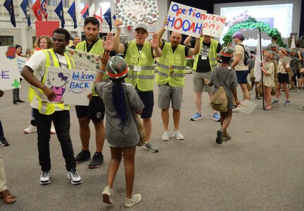 Children welcomed home and given high fives by parents.