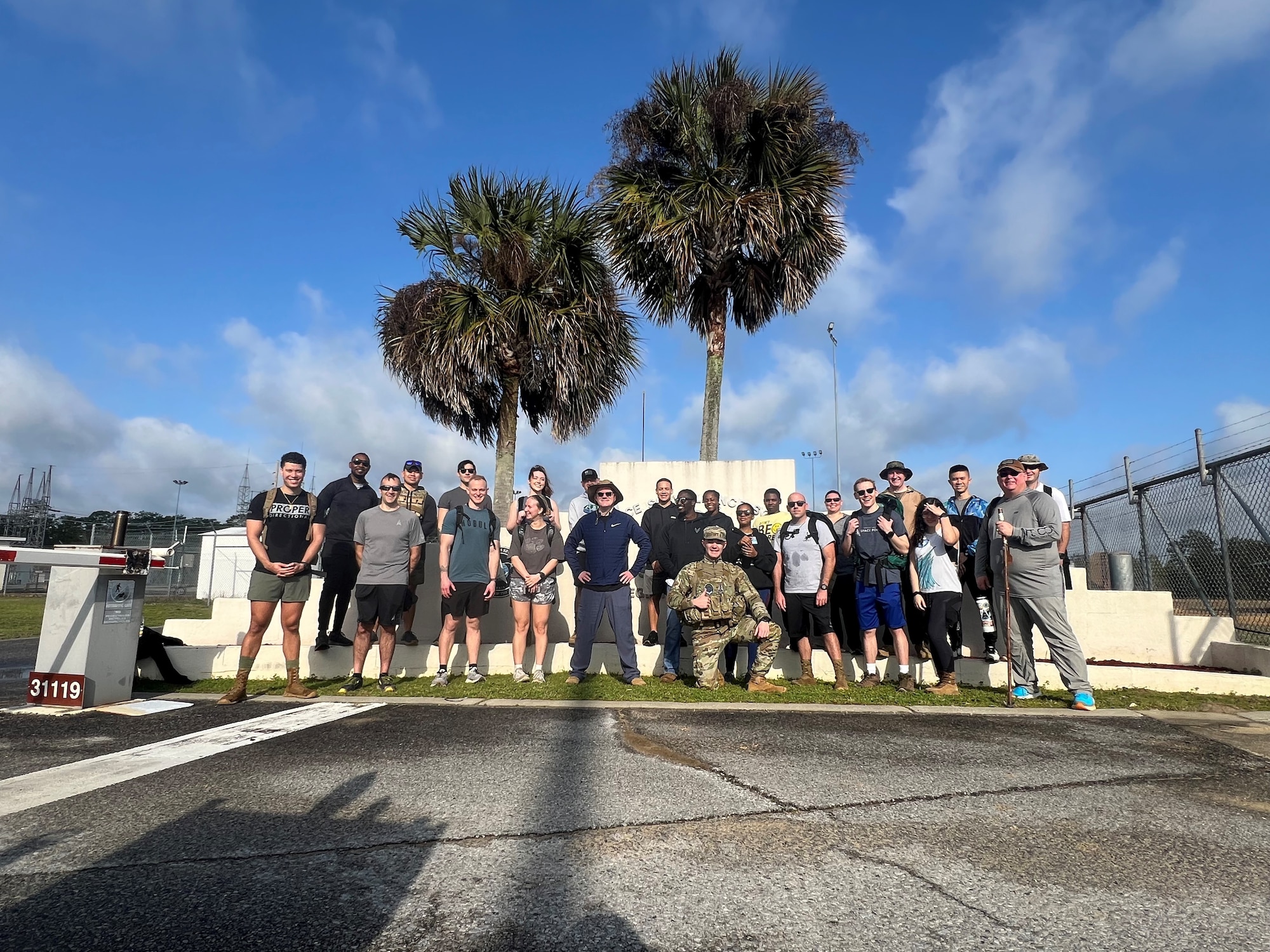 U.S. Air Force chaplain Conner Simms, center front, stands with members of the 20th Space Surveillance Squadron after completing morning PT at Eglin Air Force Base, Florida, February 20, 2024. As a member of Space Base Delta 1's Guardian Resilience Team, Simms provides Guardians and Airmen around the world with support, confidential and privileged communication, spiritual counseling. (Courtesy photo provided by Ch. Conner Simms)