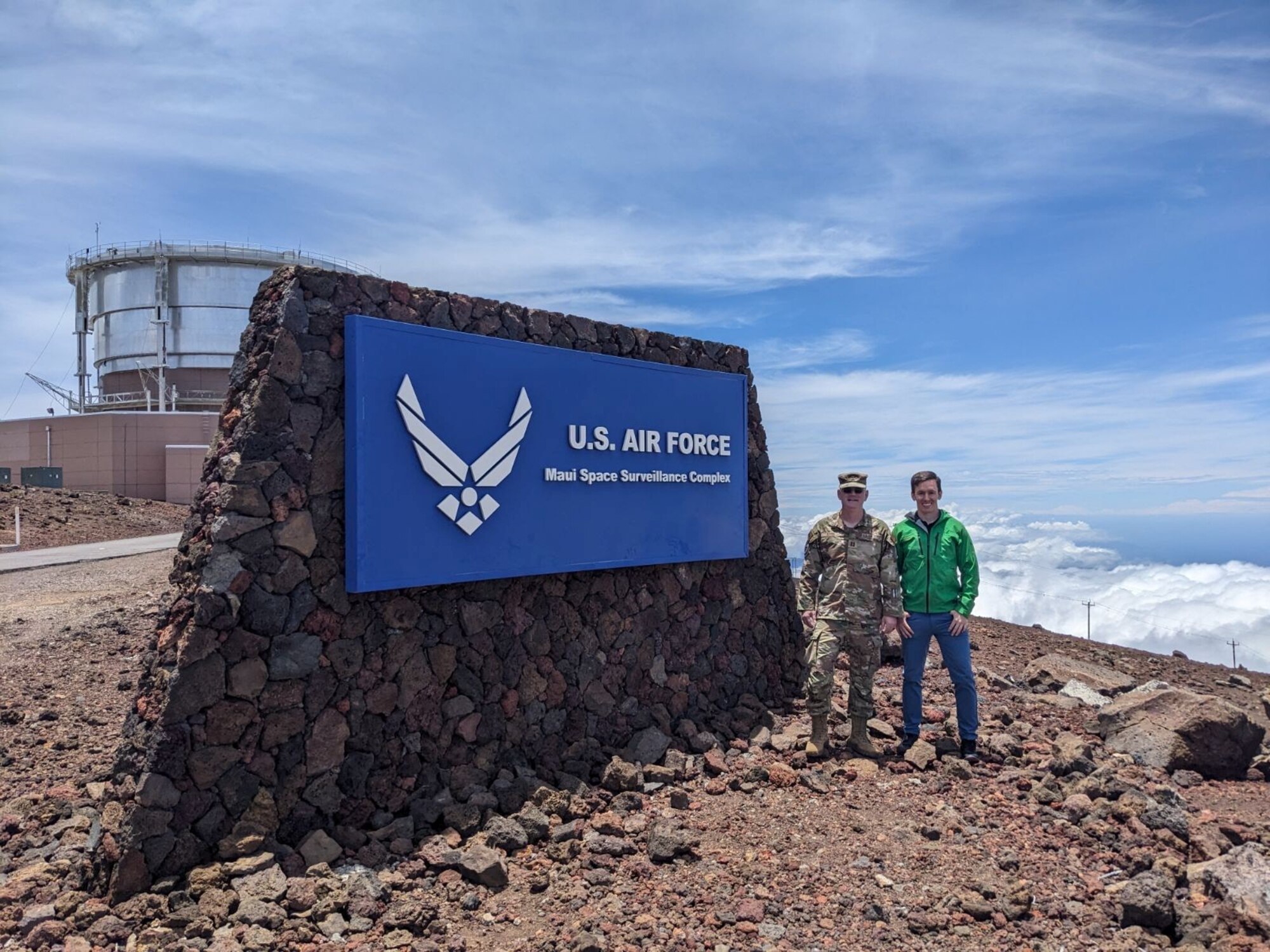 U.S. Air Force chaplain Conner Simms, left, stands atop the summit of Haleakala during a recent visit to the Maui Space Surveillance Complex, Hawaii, May 18, 2024. As a member of Space Base Delta 1's Guardian Resilience Team, Simms provides Guardians and Airmen around the world with support, confidential and privileged communication, spiritual counseling. (Courtesy photo provided by Ch. Conner Simms)