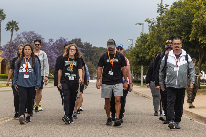 Educators march together during an Educators Workshop event at Marine Corps Recruiting Depot San Diego in San Diego, June 4, 2024. The Educators Workshop program provides selected educators and influential community members with an experiential opportunity to see how the Marine Corps transforms young men and women into Marines. The workshop also provides attendees with current information regarding Marine Corps training practices, military job skills, service opportunities, military lifestyle, and educational benefits available to Marines. (U.S. Marine Corps photo by Sgt. Ryan Harvey)