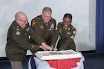 Soldiers cut  the Army birthday cake during DLA’s 249th Army birthday ceremony