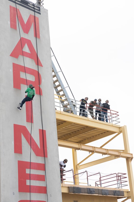 Educators from 12th Marine Corps District repel down a tower during an Educators Workshop event at Marine Corps Recruiting Depot San Diego in San Diego, June 6, 2024. The Educators Workshop program provides selected educators and influential community members with an experiential opportunity to see how the Marine Corps transforms young men and women into Marines. The workshop also provides attendees with current information regarding Marine Corps training practices, military job skills, service opportunities, military lifestyle, and educational benefits available to Marines. (U.S. Marine Corps photo by Cpl. Fred Garcia)