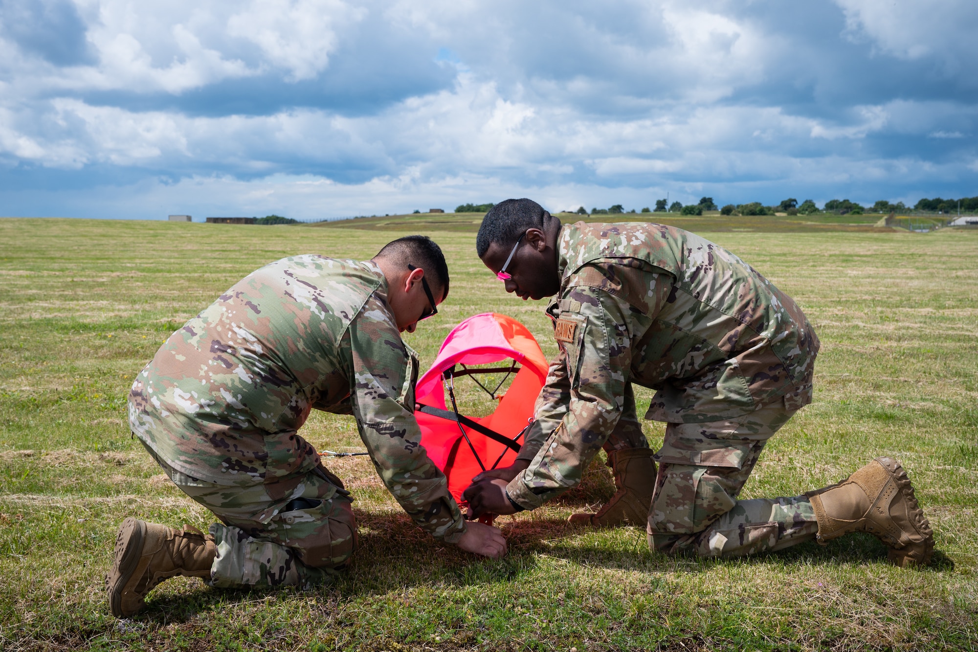 U.S. Air Force members set up landing zone marker panels.