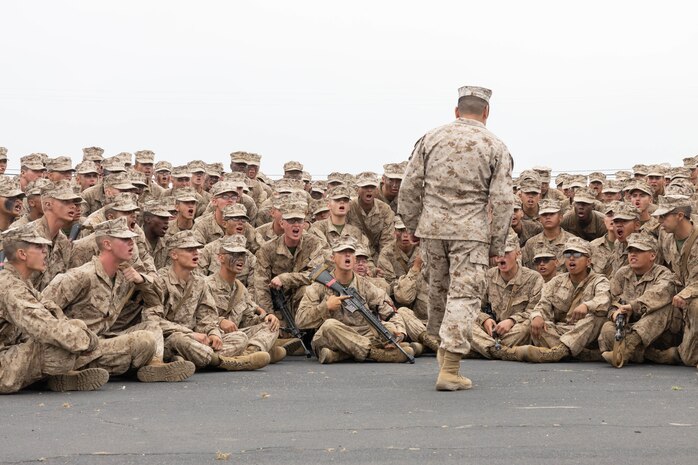 U.S. Marines with Lima Company, 3rd Recruit Training Battalion, hear a motivational speech during an Eagle, Globe and Anchor ceremony at Marine Corps Base Camp Pendleton in Oceanside, Calif., June 5, 2024. The Educators Workshop program provides selected educators and influential community members with an experiential opportunity to see how the Marine Corps transforms young men and women into Marines. The workshop also provides attendees with current information regarding Marine Corps training practices, military job skills, service opportunities, military lifestyle, and educational benefits available to Marines. (U.S. Marine Corps Cpl. Fred Garcia)