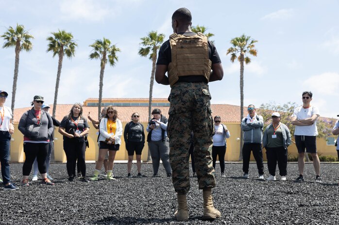 Educators from 12th Marine Corps District await a Marine Corps Martial Arts Program demonstration during an Educators Workshop event at Marine Corps Recruiting Depot San Diego in San Diego, June 4, 2024. The Educators Workshop program provides selected educators and influential community members with an experiential opportunity to see how the Marine Corps transforms young men and women into Marines. The workshop also provides attendees with current information regarding Marine Corps training practices, military job skills, service opportunities, military lifestyle, and educational benefits available to Marines. (U.S. Marine Corps photos by Cpl. Fred Garcia)