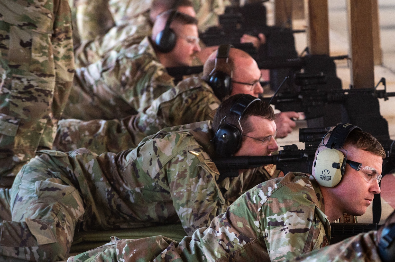 Airmen assigned to 167th Airlift Wing fire the M4 carbine during weapon qualification training at the 167th Airlift Wing firing range, Martinsburg, West Virginia, June 7, 2024.