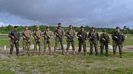 International competitors from El Salvador, Cabo Verde and Canada convene on the firing line at the 2024 New Hampshire National Guard Combat Marksmanship Match on June 6 at Fort Devens, Mass. About 90 competitors formed 21 teams during the three-day match and fired various rifle and pistol courses of fire.