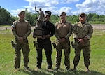 Team El Salvador hoists the Remington Centennial Trophy at the 2024 New Hampshire National Guard Combat Marksmanship Match on June 8 at Fort Devens, Mass. The squad successfully defended its title as reigning champions against 20 four-person teams. New Hampshire Army National Guard teams, 