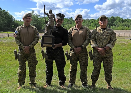 Team El Salvador hoists the Remington Centennial Trophy at the 2024 New Hampshire National Guard Combat Marksmanship Match on June 8 at Fort Devens, Mass. The squad successfully defended its title as reigning champions against 20 four-person teams.