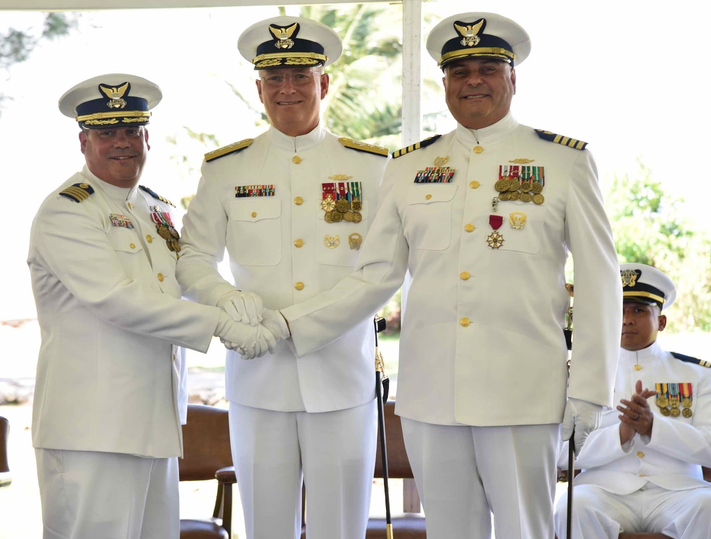 Capt. Luis J. Rodríguez (left), Rear Adm. Douglas M. Schofield (center) and Capt. José E. Díaz (right) following the transfer command authority during the Sector San Juan Change of Command Ceremony in San Juan, Puerto Rico June 13, 2024. During the ceremony, Capt. Rodríguez relieved Capt. Díaz as the commander of Sector San Juan. Capt. Rodríguez will be responsible for leading Coast Guard forces in Puerto Rico and the U.S. Virgin Islands and the oversight of a 1.3 million square nautical mile area of responsibility in the Eastern Caribbean. (Coast Guard photo by Ricardo Castrodad)