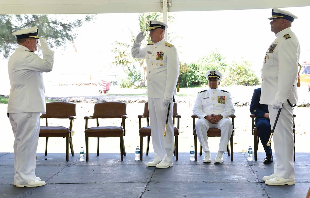 Capt. Luis J. Rodríguez (left), Rear Adm. Douglas M. Schofield (center) and Capt. José E. Díaz (right) transfer command authority during the Sector San Juan Change of Command Ceremony in San Juan, Puerto Rico June 13, 2024. During the ceremony, Capt. Rodríguez relieved Capt. Díaz as the commander of Sector San Juan. Capt. Rodríguez will be responsible for leading Coast Guard forces in Puerto Rico and the U.S. Virgin Islands and the oversight of a 1.3 million square nautical mile area of responsibility in the Eastern Caribbean. (Coast Guard photo by Ricardo Castrodad)