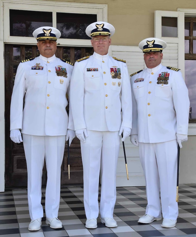 Capt. José E. Díaz (left), Rear Adm. Douglas M. Schofield (center) and Capt. Luis J. Rodríguez (right) during the Sector San Juan Change of Command Ceremony in San Juan, Puerto Rico June 13, 2024. During the ceremony, Capt. Rodríguez relieved Capt. Díaz as the commander of Sector San Juan. Capt. Rodríguez will be responsible for leading Coast Guard forces in Puerto Rico and the U.S. Virgin Islands and the oversight of a 1.3 million square nautical mile area of responsibility in the Eastern Caribbean. (Coast Guard photo by Ricardo Castrodad)