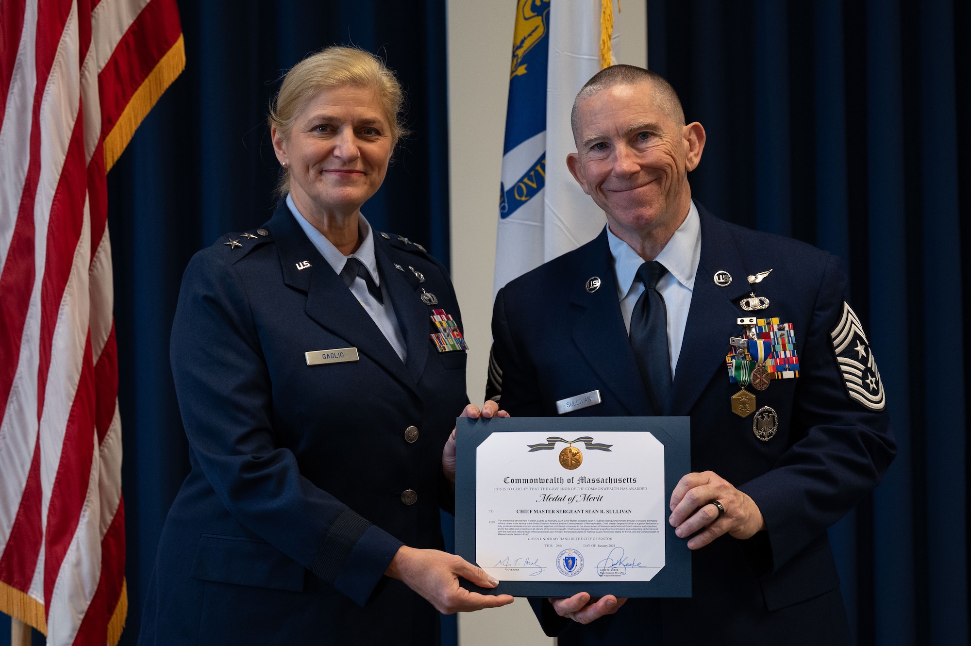 Chief Master Sgt. Sean Sullivan poses with an award.
