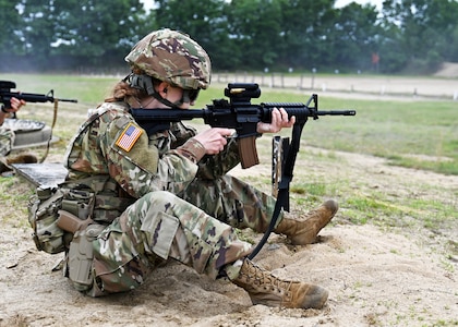 Sgt.1st Class Alexandria Tichy of the 39th Army Band fires her issued M4 during a rifle course at the 2024 New Hampshire National Guard Combat Marksmanship Match on June 7 at Fort Devens, Mass. Tichy and three fellow members of the 39th formed a four-person squad to comprise a field of 21 teams, which also included competitors from El Salvador, Cabo Verde and Canada.