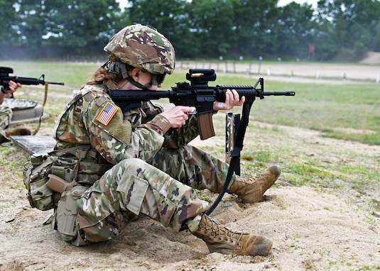 Sgt.1st Class Alexandria Tichy of the 39th Army Band fires her issued M4 during a rifle course at the 2024 New Hampshire National Guard Combat Marksmanship Match on June 7 at Fort Devens, Mass. Tichy and three fellow members of the 39th formed a four-person squad to comprise a field of 21 teams, which also included competitors from El Salvador, Cabo Verde and Canada.